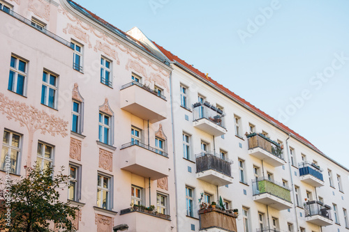 pink and white facaded houses in a row