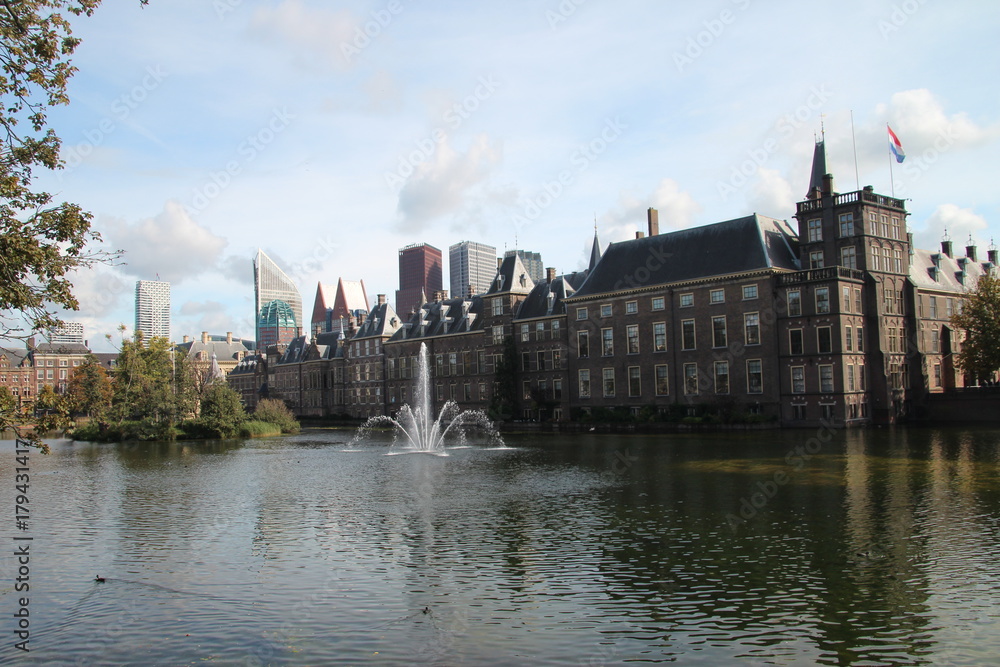 Dutch parliament building Binnenhof at the Hofvijver with fountainb
