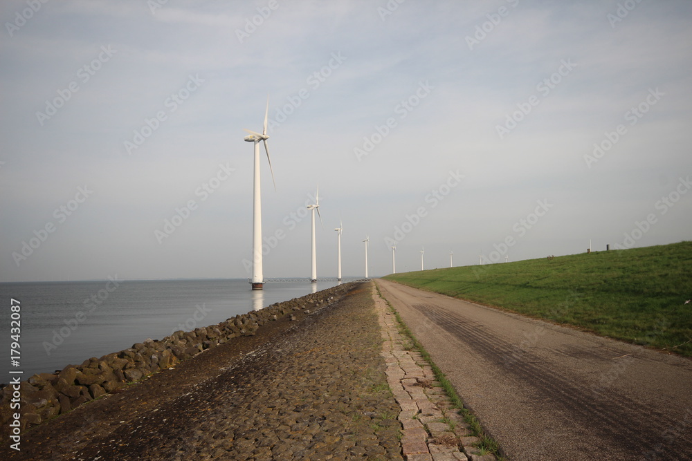 Windmills along the IJsselmeer in Flevoland, The Netherlands