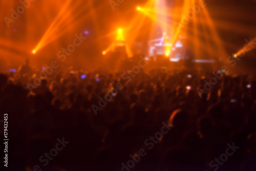 blurry image background of many audience concert in big rock concert.