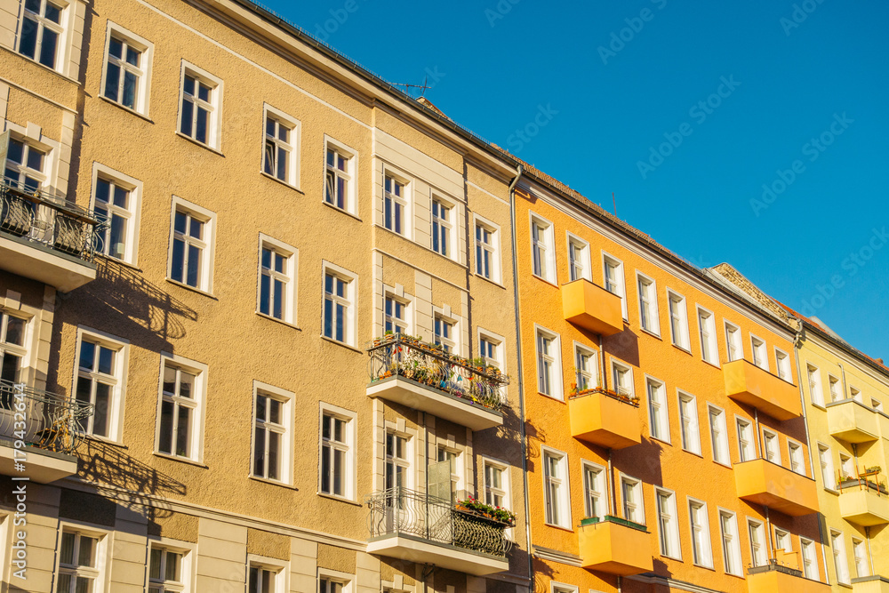 high contrasted orange buildings in a row