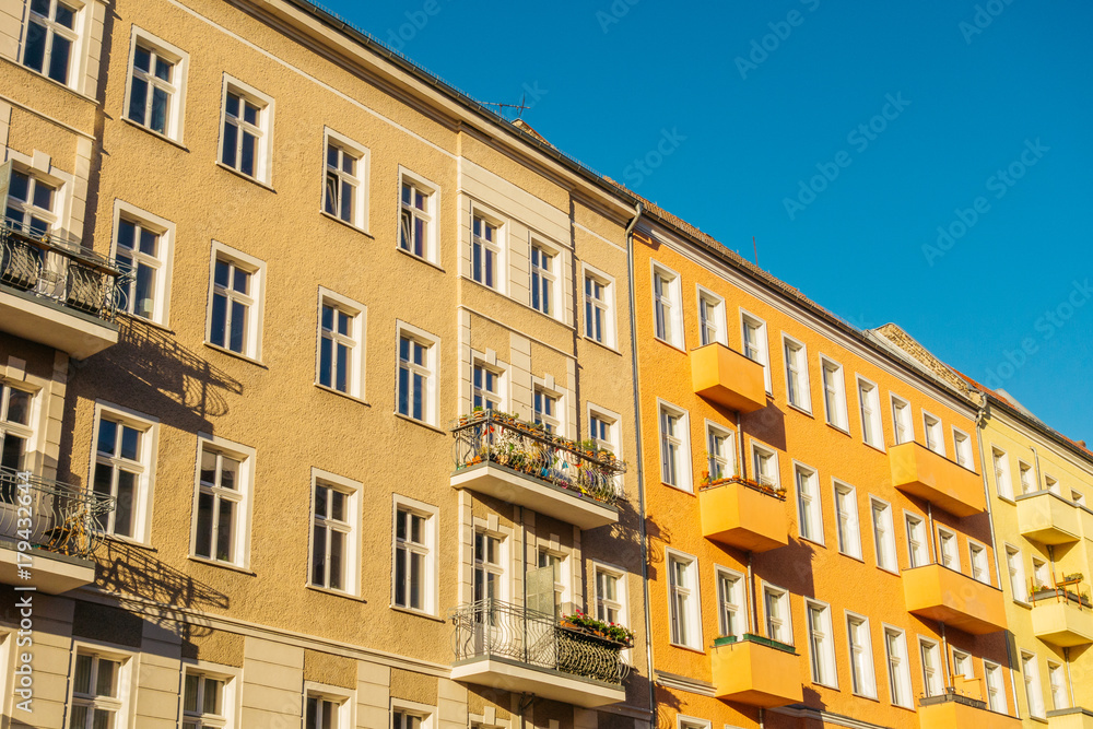 high contrasted orange buildings in a row high contrasted orange buildings in a row