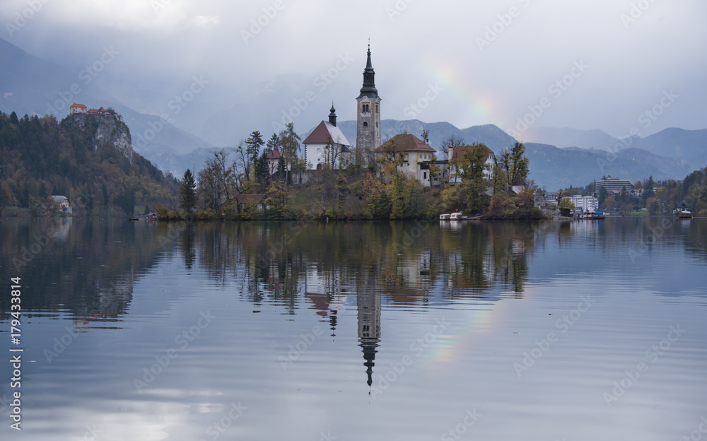 Rainbow over the church on the island of Bled lake, Slovenia