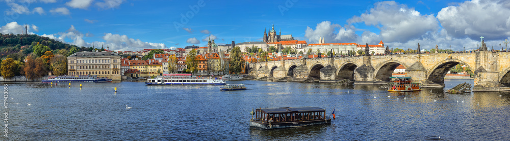 Prague, Czech Republic - October 10, 2017: Beautiful autumn river view on Vltava river, Charles Bridge and   Cathedral of Saints Vitus and Prague Castle , Czech Republic. Panorama.
