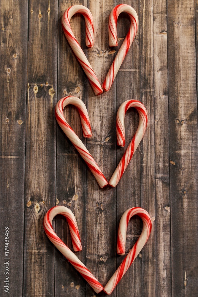 Christmas Candy cane frame on rustic wooden background with copy space Christmas Candy cane frame on rustic wooden background with copy space