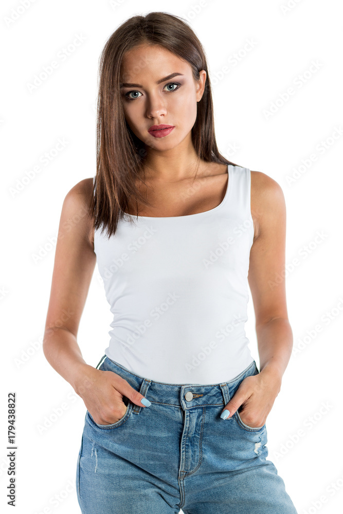 Obraz premium Beautiful young woman in jeans and a white t-shirt