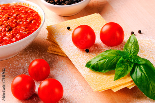 Lasagna ingrediens on wooden table photo