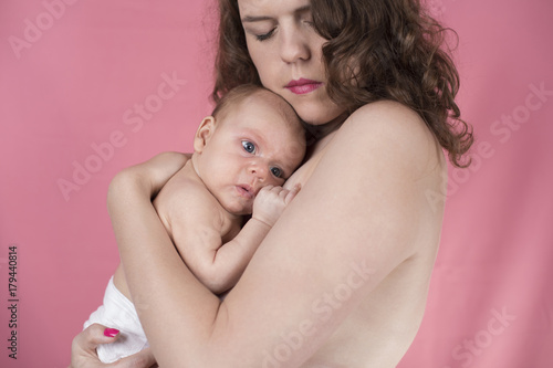 Cute newborn baby hand holding mother