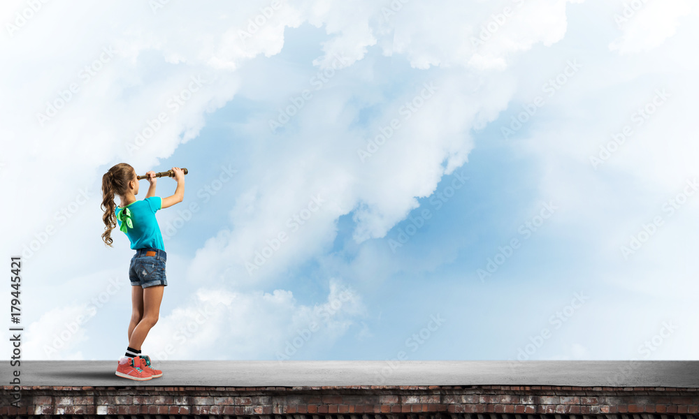 Concept of careless happy childhood with girl exploring this world Concept of careless happy childhood with girl exploring this world