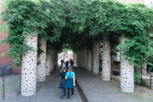 a boy and a girl walk in a street in kolding