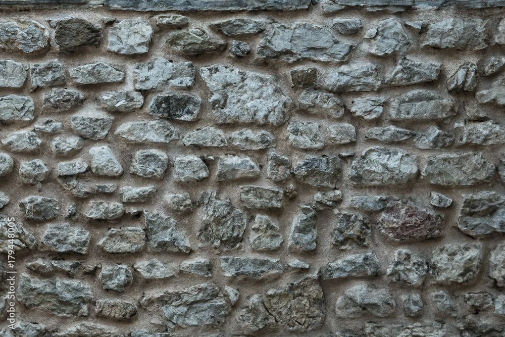 Granite texture, stone wall surface closeup Granite texture, stone wall surface closeup