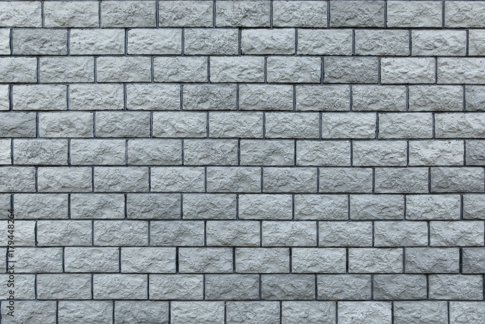 Fototapeta premium Gray stone bricks, wall texture, rocky surface closeup