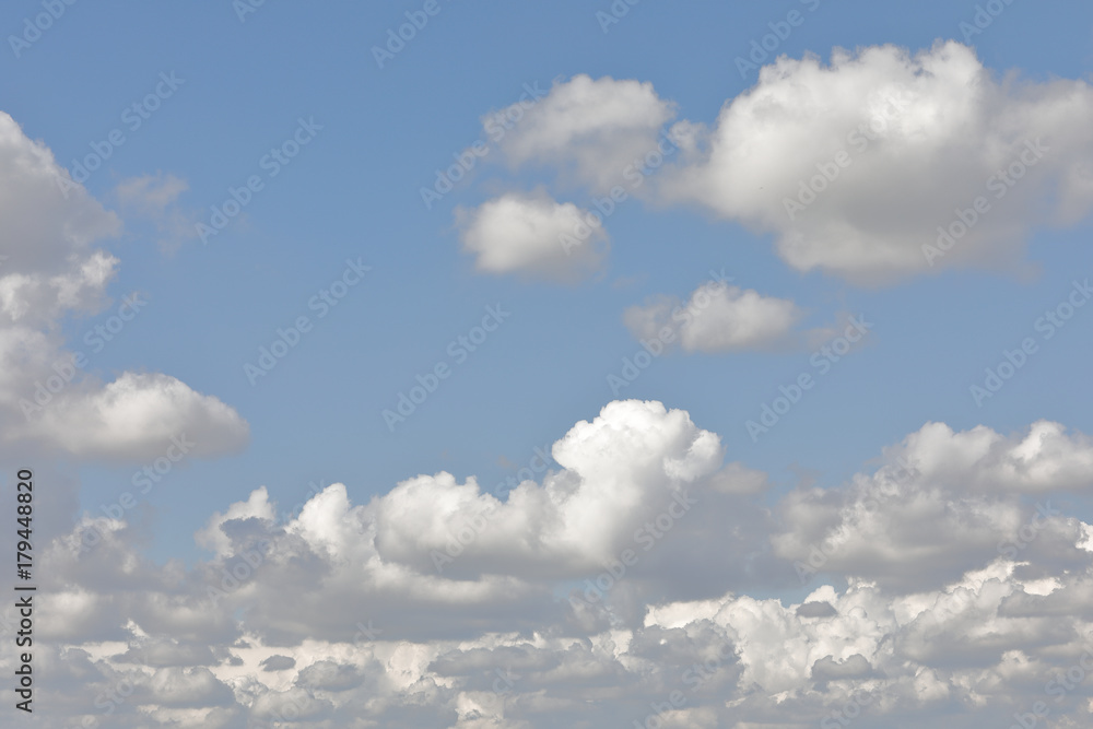 clouds scattered in a blue sky clouds scattered in a blue sky