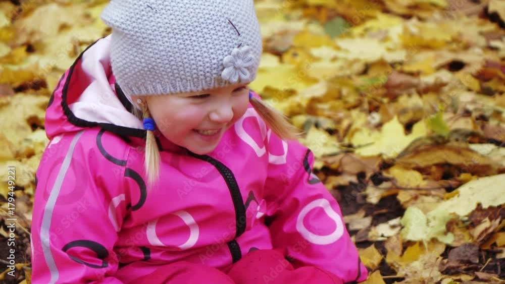 Baby girl smiling in autumn park Baby girl smiling in autumn park