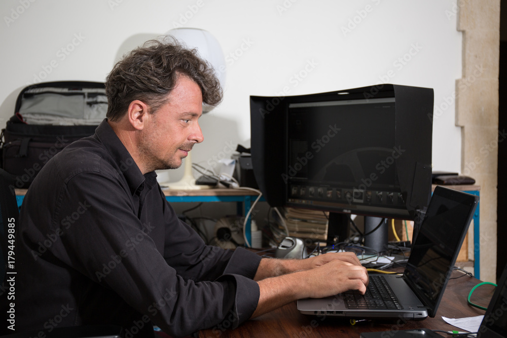 shot of man using laptop with blank screen, small business people concept shot of man using laptop with blank screen, small business people concept