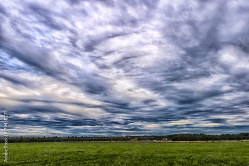 sky with rain clouds over the field photo