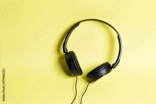 headphones black on a yellow background