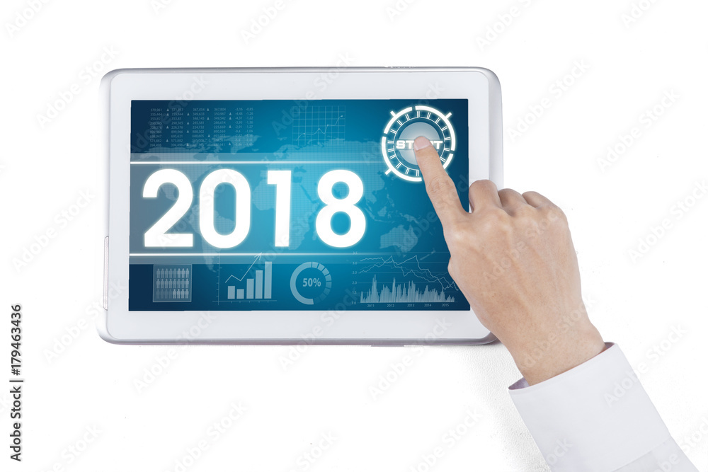 Businessman hand touching a start button Businessman hand touching a start button