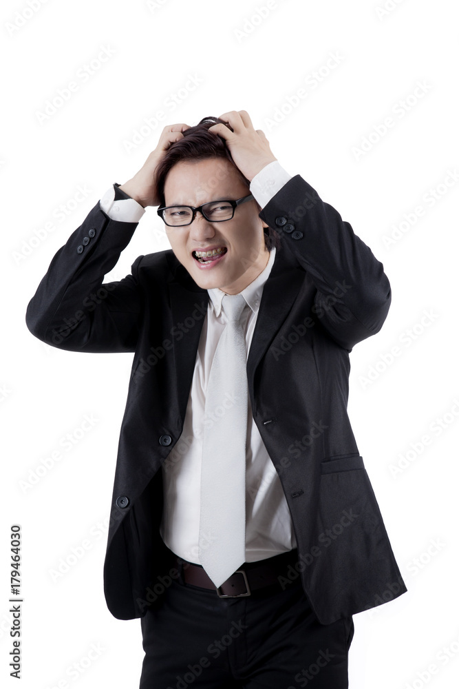 Asian businessman having a headache on studio Asian businessman having a headache on studio