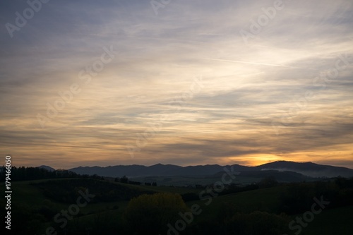 Sunset and sunrise with dramatic colorful clouds. Slovakia