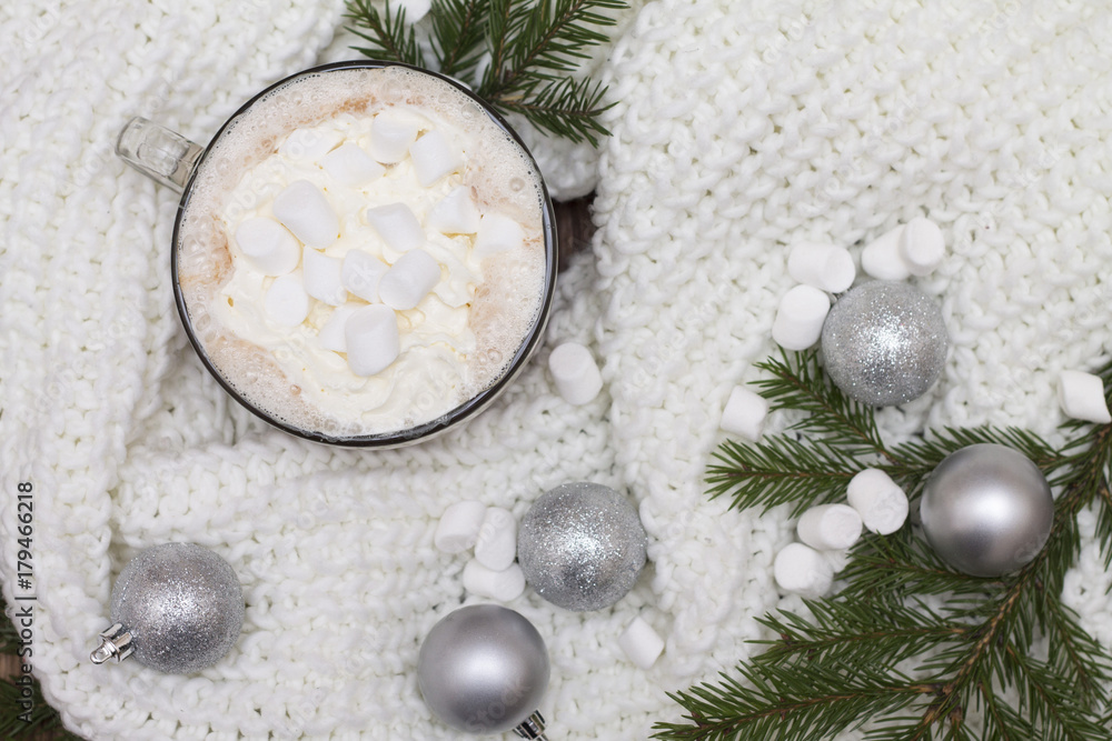 delicious hot cocoa with marshmallows on the Christmas table Christmas balls, fir branches knitted scarf warmth and comfort delicious hot cocoa with marshmallows on the Christmas table Christmas balls, fir branches knitted scarf warmth and comfort