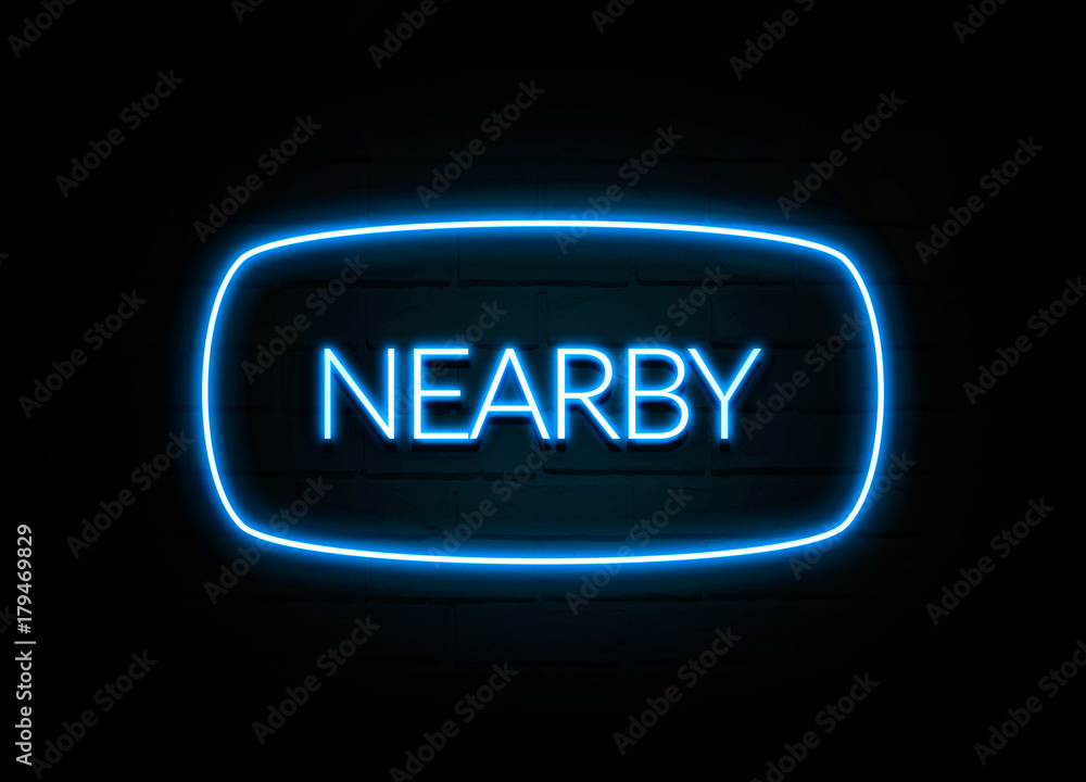 Nearby - colorful Neon Sign on brickwall Nearby - colorful Neon Sign on brickwall