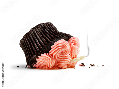 Fotografija Accident, dropped cupcake with candle and smoke isolated on white