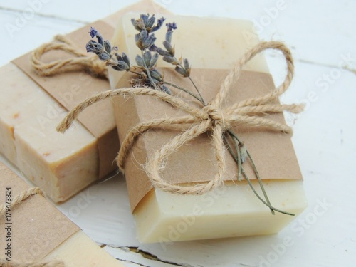 Handmade spa lavender soap on vintage wooden background. Soap making. Soap bars. Spa, skin care.
