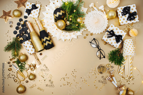 Christmas decoration background in golden and black colors. Flat lay, top view