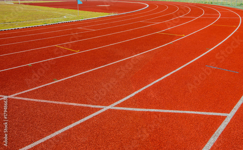 Red Running track with corner of the football field.