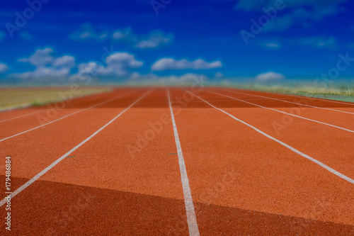 Red Running track with corner of the football field.