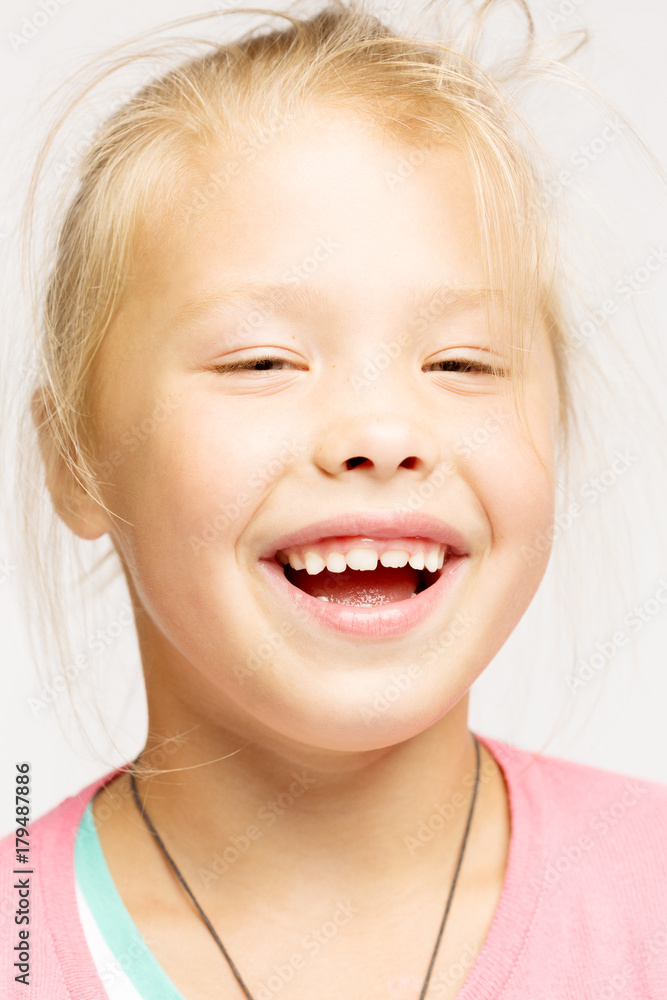 Little girl, blonde, laughs, close-up Little girl, blonde, laughs, close-up