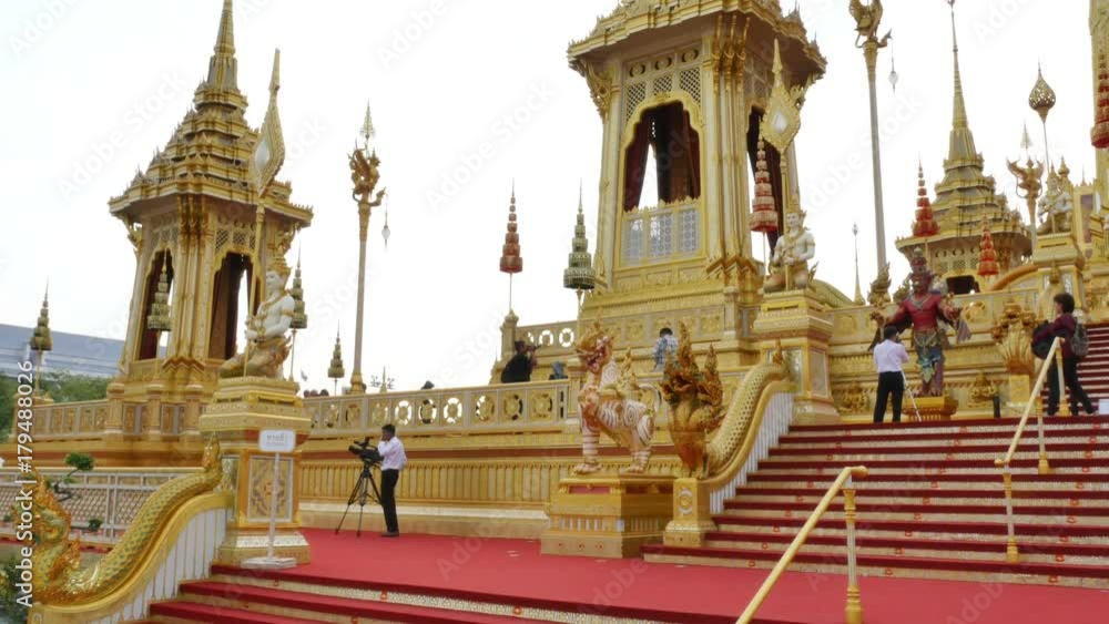 Bangkok, Thailand - October, 01 2017: Crowds of mourners to The funeral pyre tower of King Bhumibol Adulyadej. The King of Thailand at Sanam Luang Bangkok, Thailand. Bangkok, Thailand - October, 01 2017: Crowds of mourners to The funeral pyre tower of King Bhumibol Adulyadej. The King of Thailand at Sanam Luang Bangkok, Thailand.