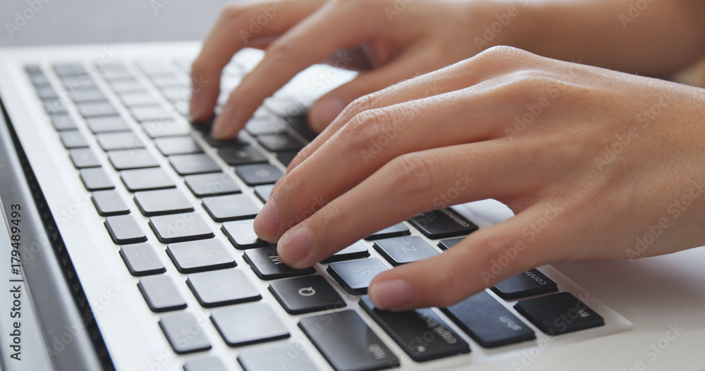 Typing on laptop computer keyboard Typing on laptop computer keyboard