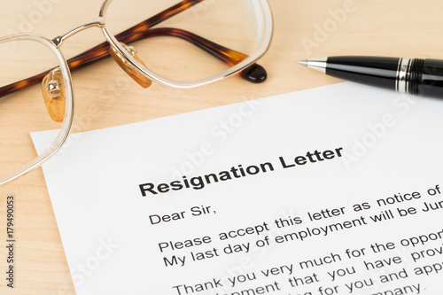 Resignation letter resign with pen and glasses