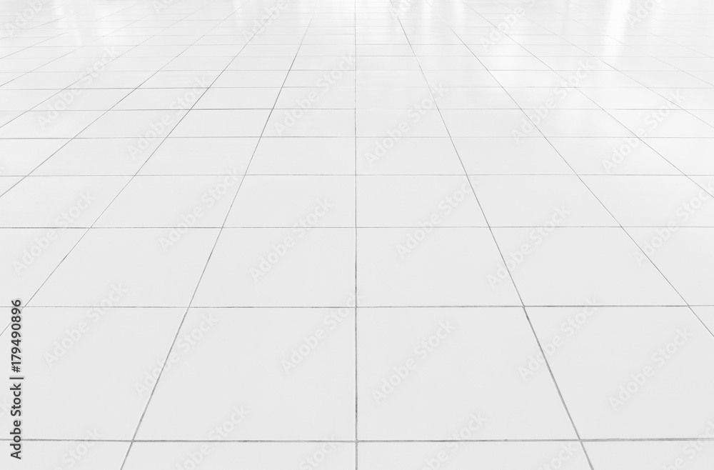 White tile floor background in perspective view. Clean, shiny, symmetry with grid line texture. For decoration in bathroom, kitchen and laundry room. And empty or copy space for product display also. White tile floor background in perspective view. Clean, shiny, symmetry with grid line texture. For decoration in bathroom, kitchen and laundry room. And empty or copy space for product display also.