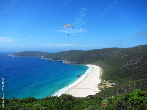 Paraglider over beach