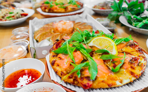Smoked Salmon Pizza and Gyoza Dumplings, Combination of Popular Eastern and Western Food