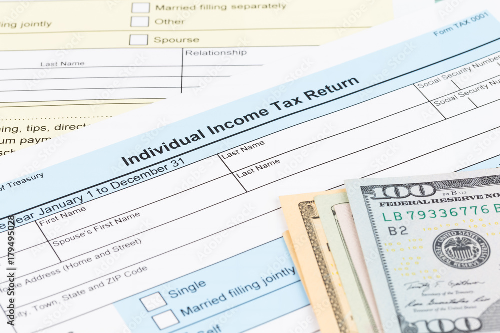 Tax form with dollar banknote; document are mock-up Tax form with dollar banknote; document are mock-up