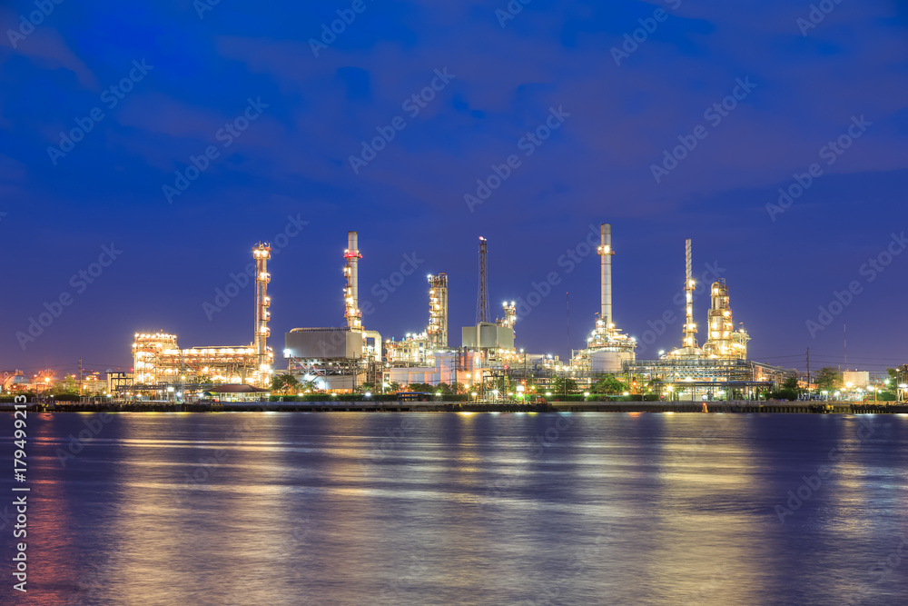 Oil refinery on water front at twilight Oil refinery on water front at twilight