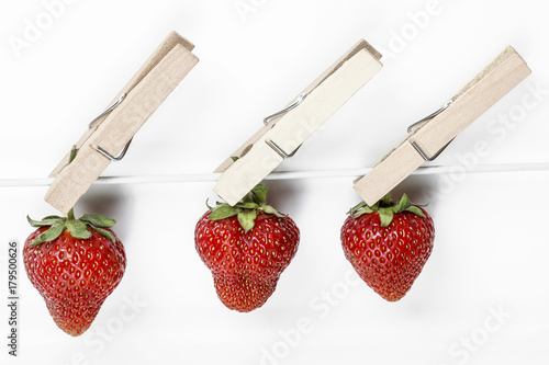 Foto Strawberries hanging on the line