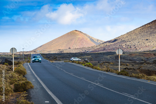 Volcanic landscape with a road on the island of LanzaroteCanary Islands. Spain