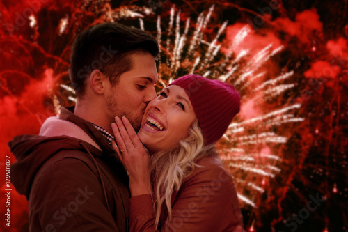 Happy Couple in Love Celebrating Christmas With Amazing Fireworks