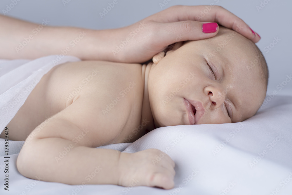 Cute newborn baby hand holding mother Cute newborn baby hand holding mother