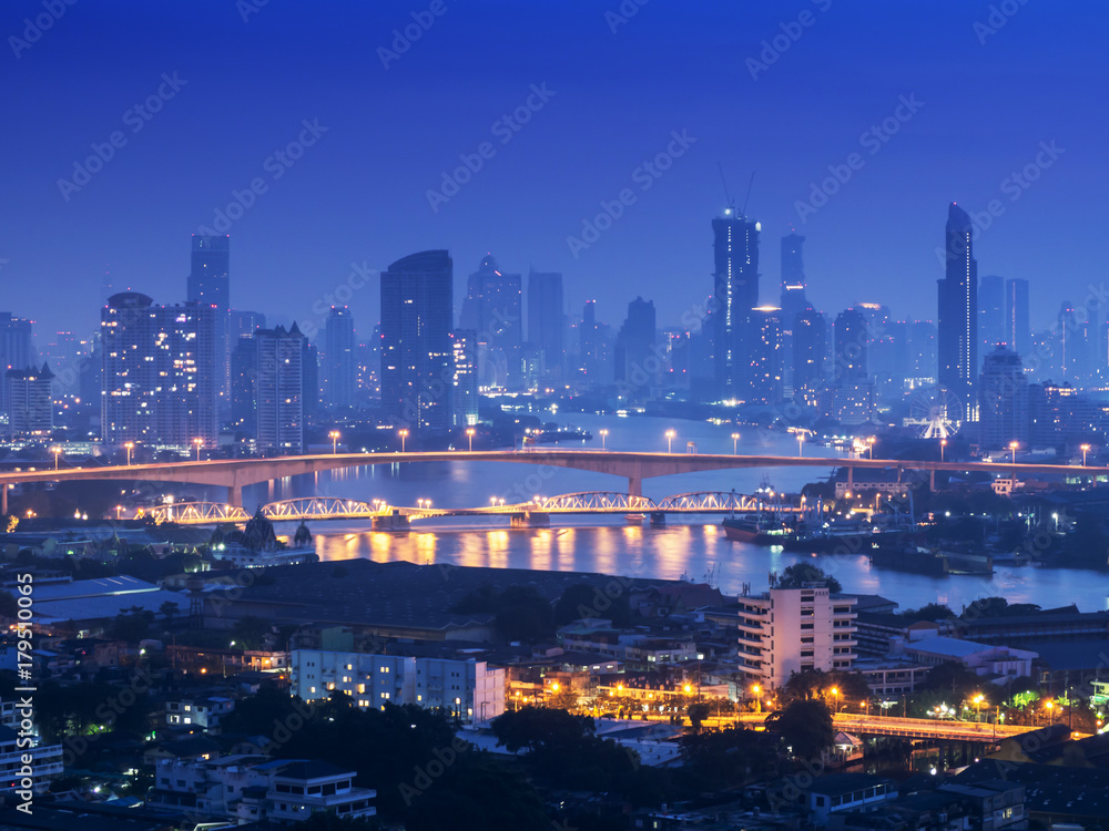 Bangkok river side cityscape. Bangkok night view in the business district. at twilight.Panorama view of Bangkok cityscape at night time. vintage colour tone 