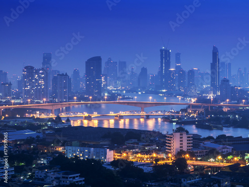 Bangkok river side cityscape. Bangkok night view in the business district. at twilight.Panorama view of Bangkok cityscape at night time. vintage colour tone  © anon