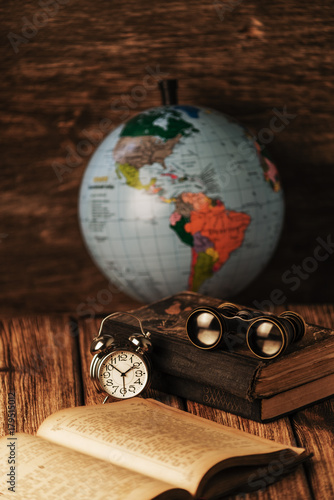 An old book of binoculars against the background of an old tree