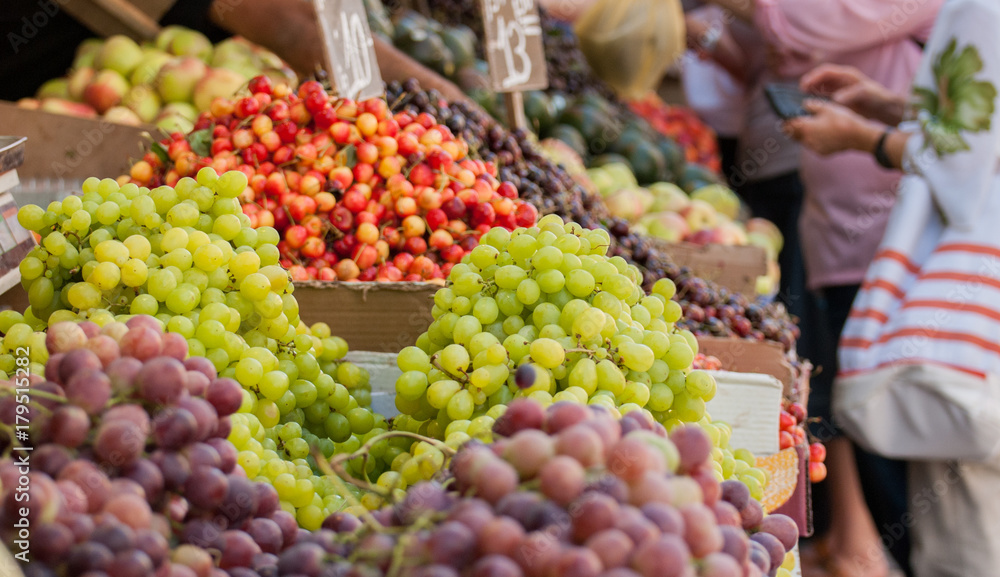 Grapes, cherries and other fruits for sale at Mahane Yehuda Market, popular marketplace in Jerusalem, Israel