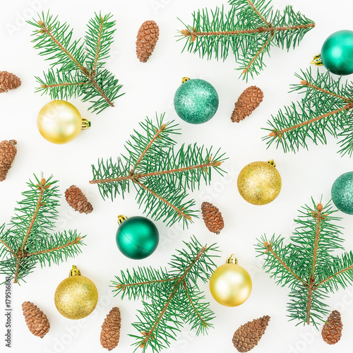 Christmas pattern of winter trees, pine cones and Christmas balls on white background. New year composition. Flat lay, top view