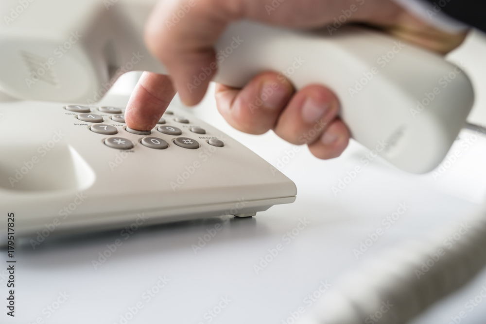 Closeup of businessman making a telephone call Closeup of businessman making a telephone call